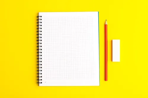 front-view-open-copybook-with-pencil-yellow-surface_140725-64130.webp